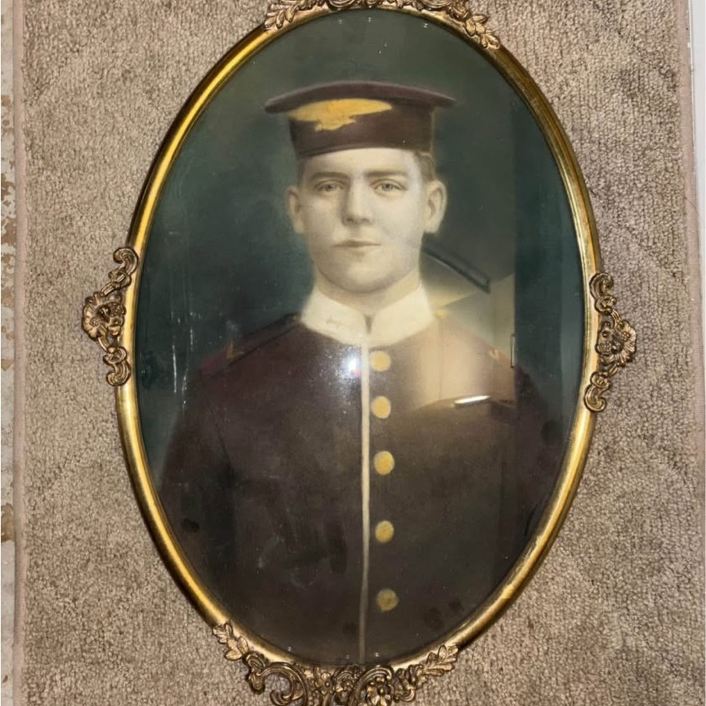 Vintage Oval Framed Portrait with Gold Accents
